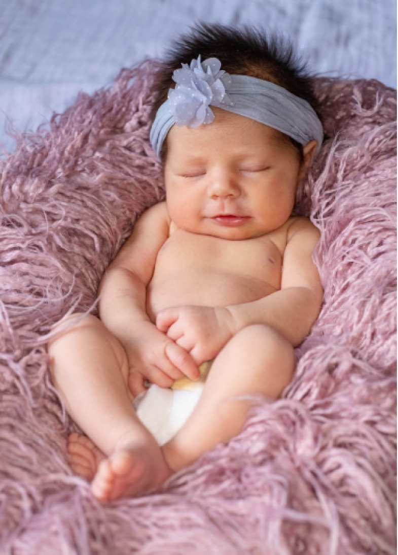 A baby smiling after first bath