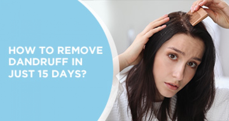 Girl removing dandruff with wooden comb